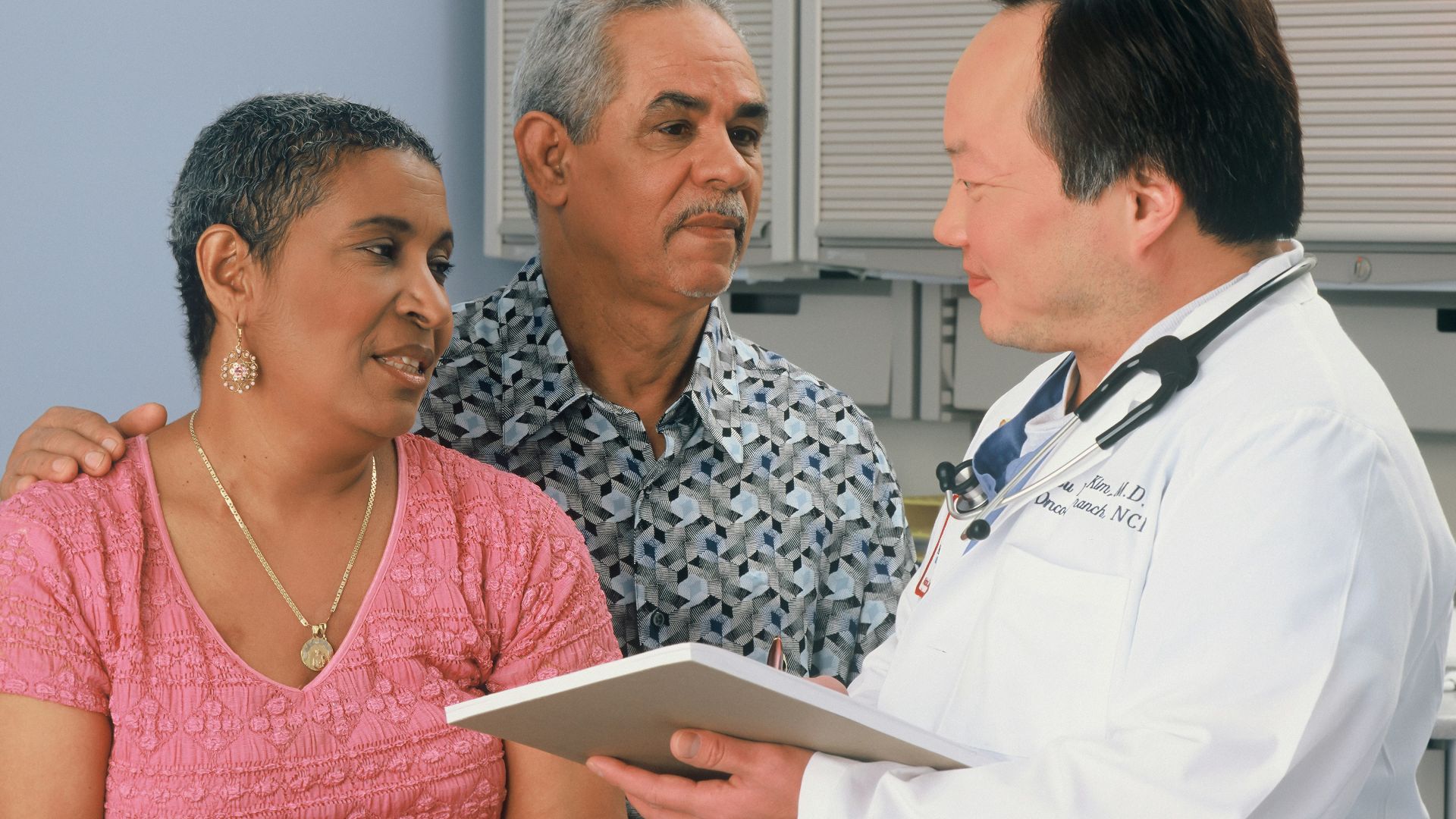 man in white button up shirt holding white tablet computer