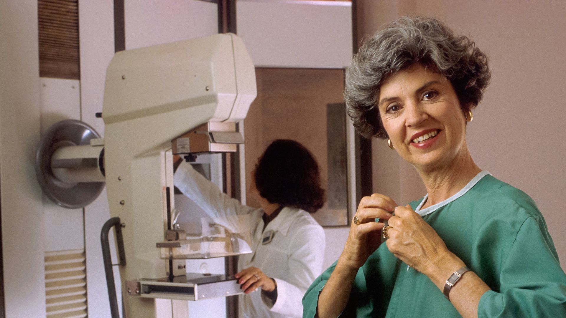 a woman standing in front of a machine