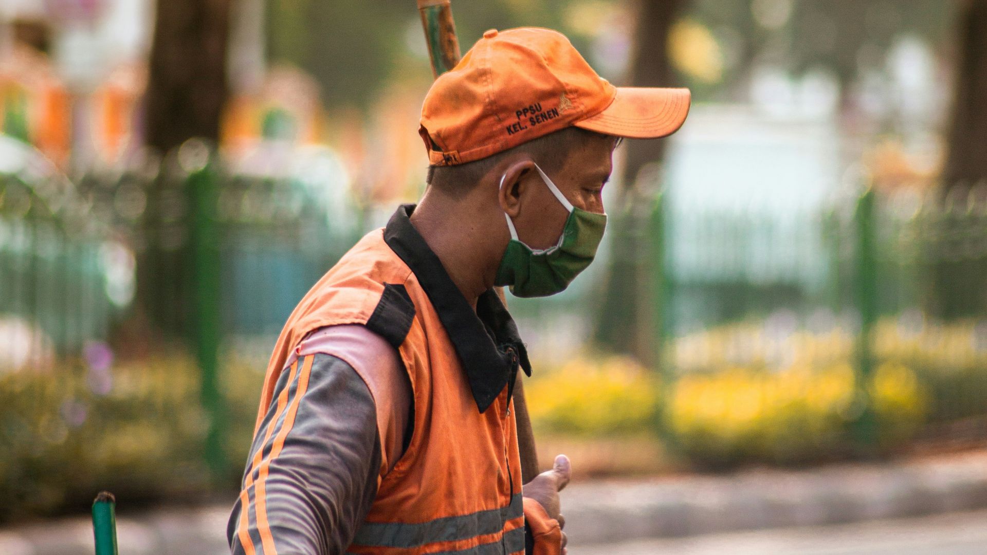 man in brown hat and brown and black stripe long sleeve shirt wearing brown hat