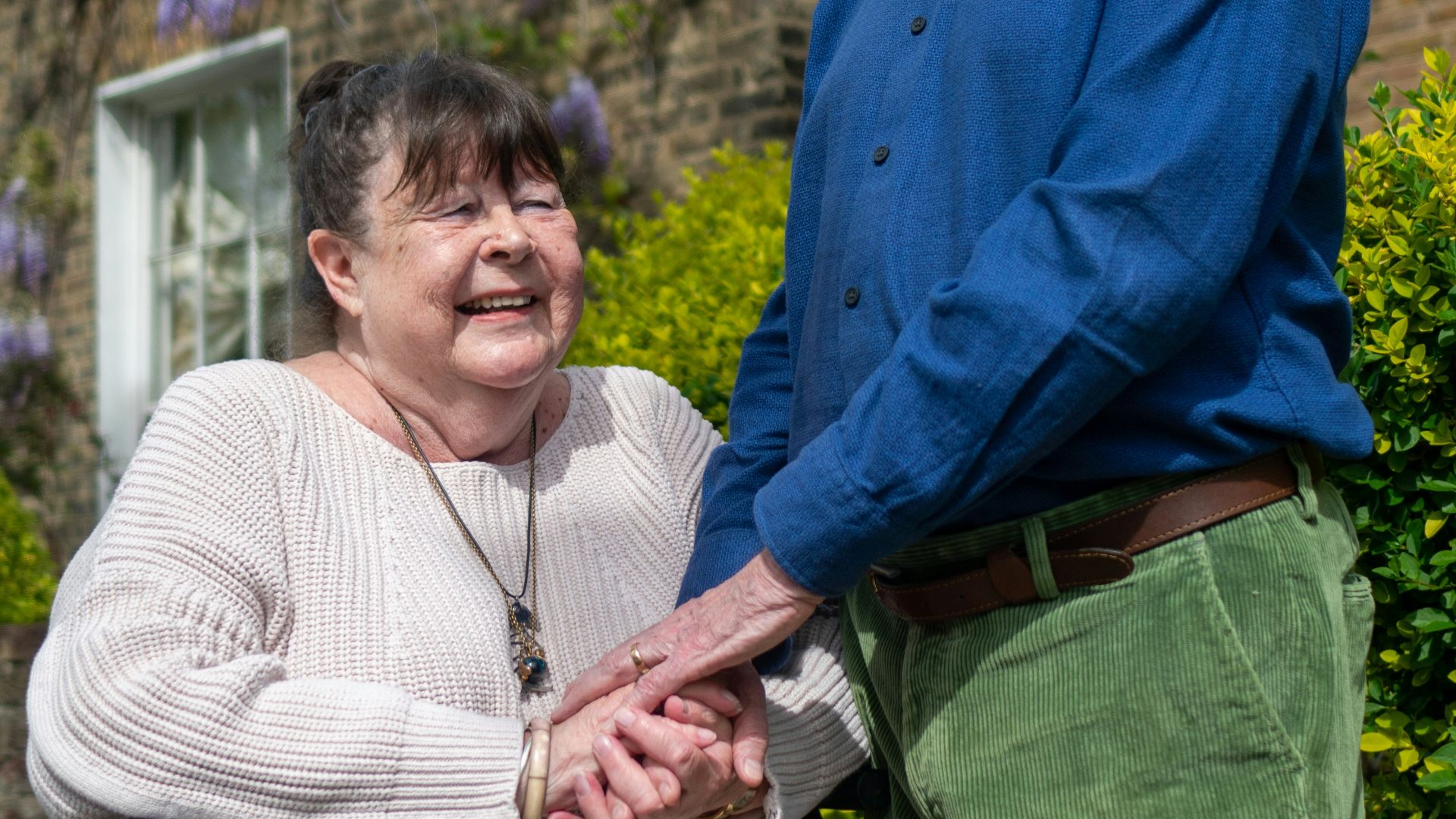 a man and a woman standing outside