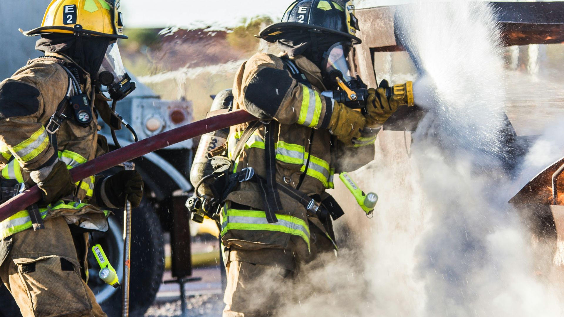 three fireman preventing fire during daytime