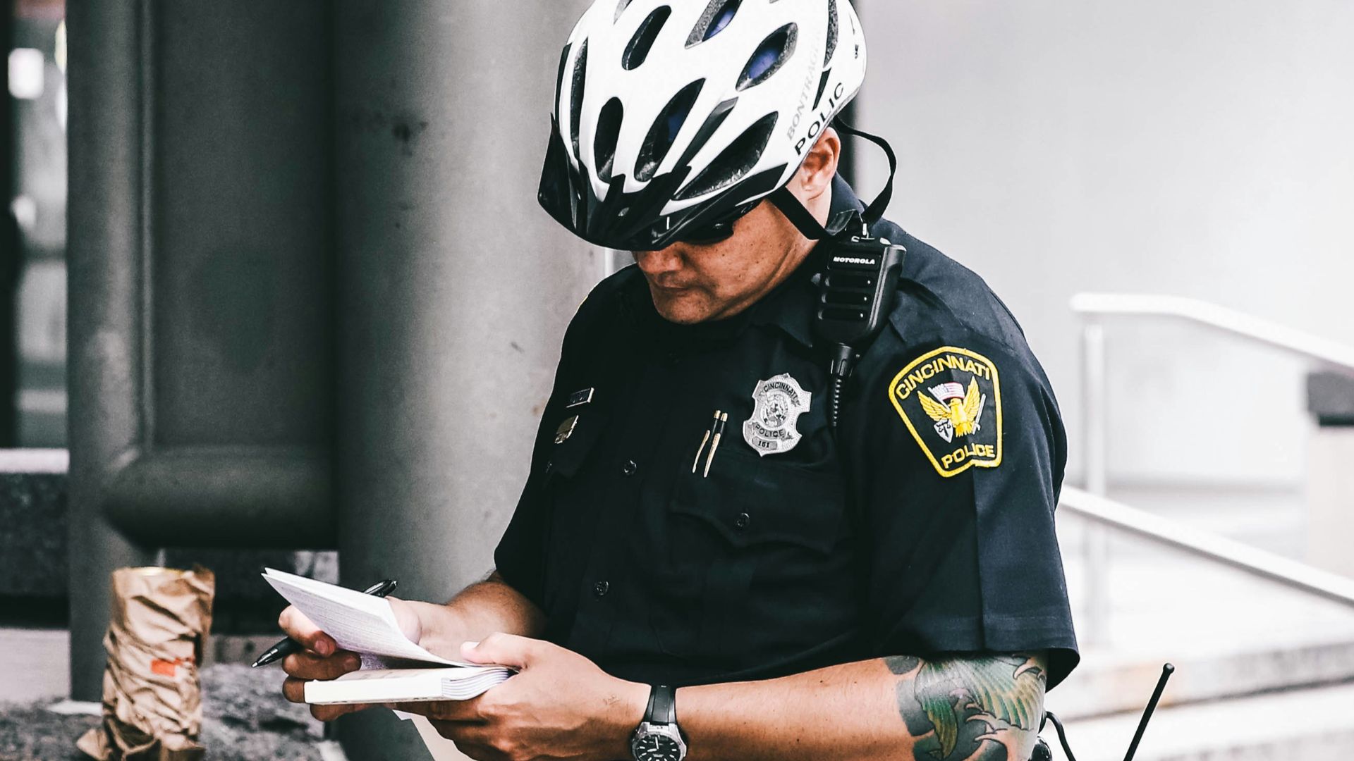 officer reading notes