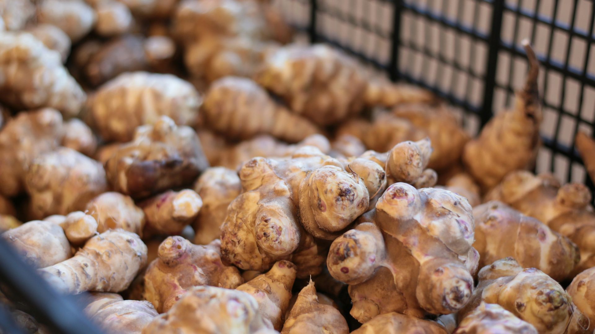 A basket filled with lots of food sitting on top of a table