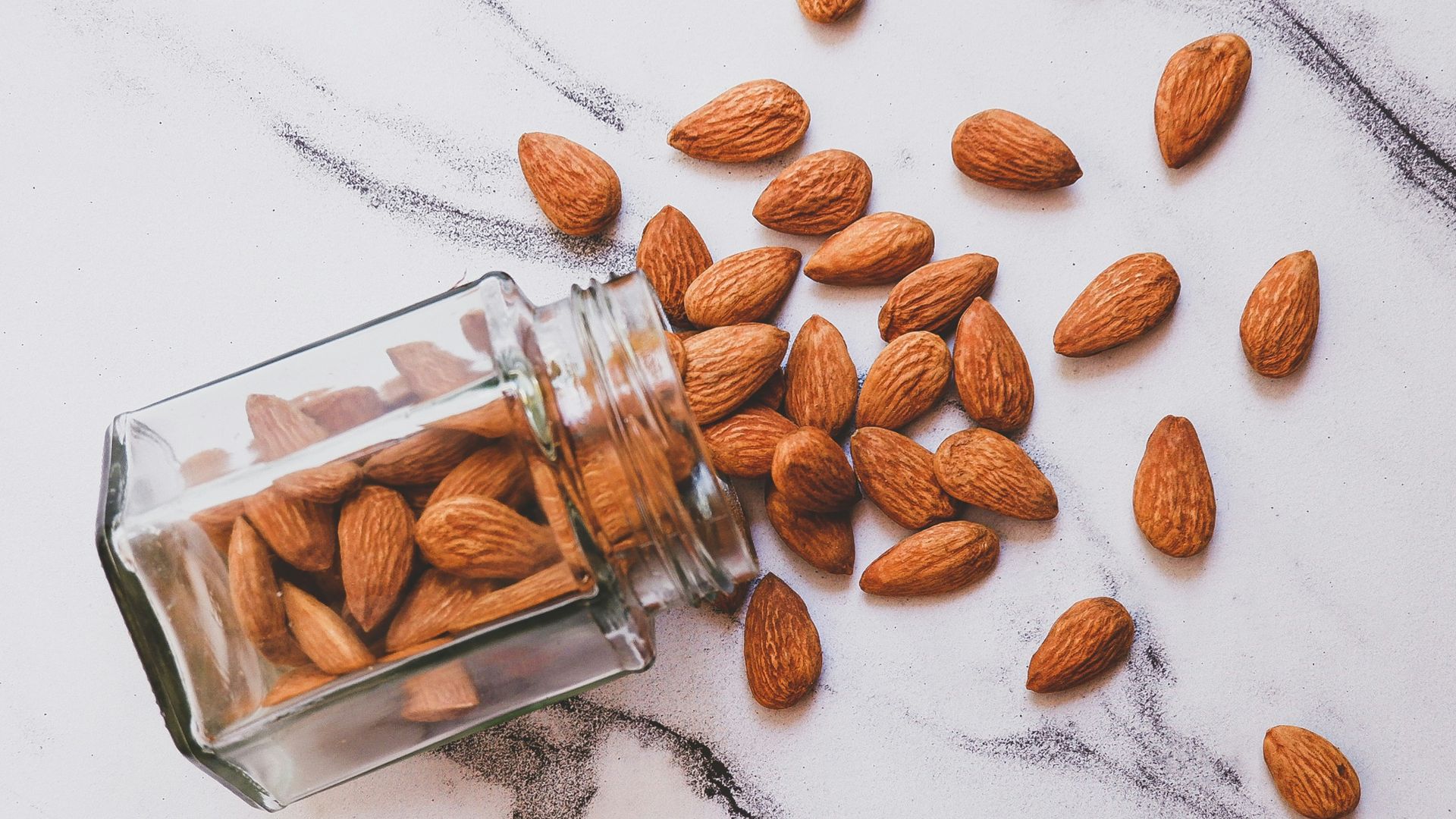brown almond on white table
