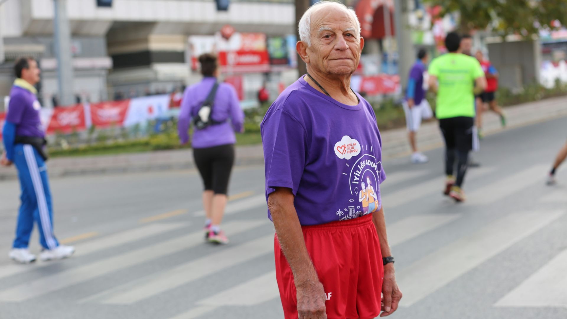 man in purple and white printed crew-neck t-shirt