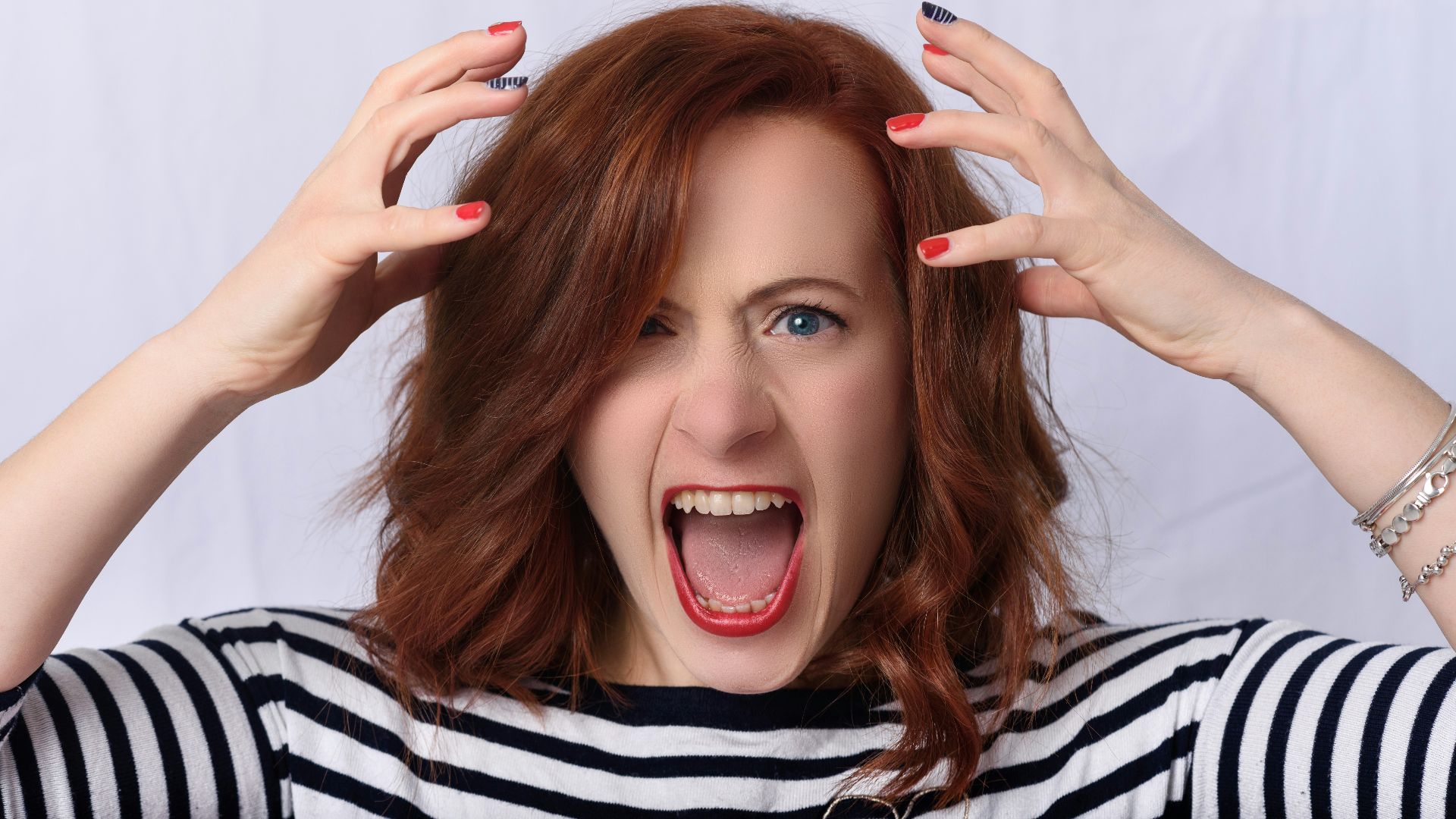 smiling girl in black and white striped shirt