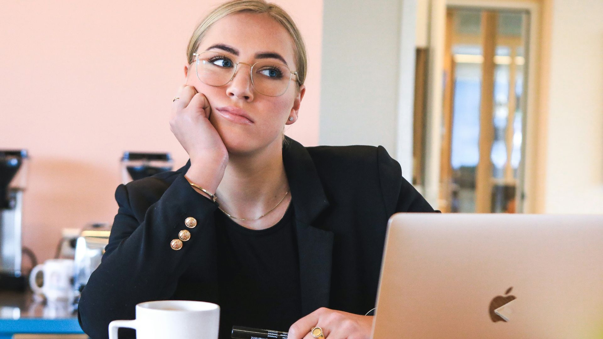 woman in black long sleeve shirt using macbook