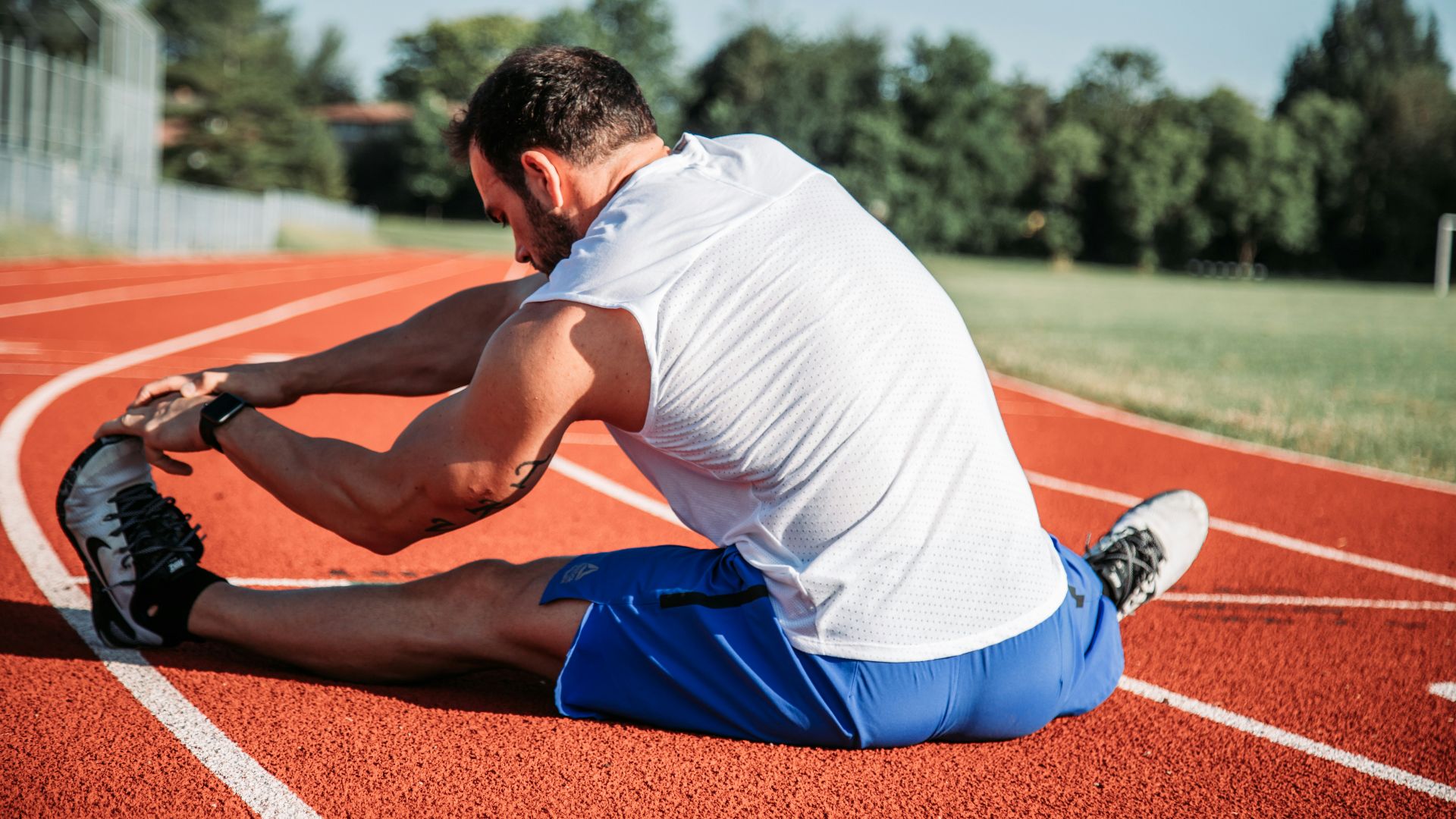 man in white sleeveless top