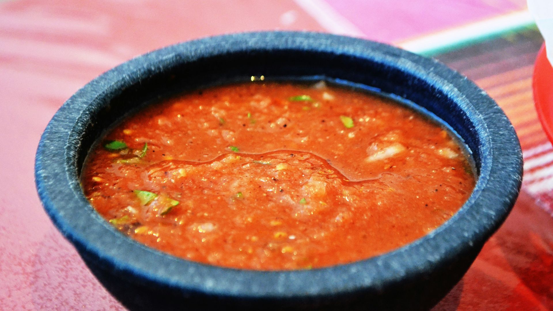a bowl of soup sitting on top of a table