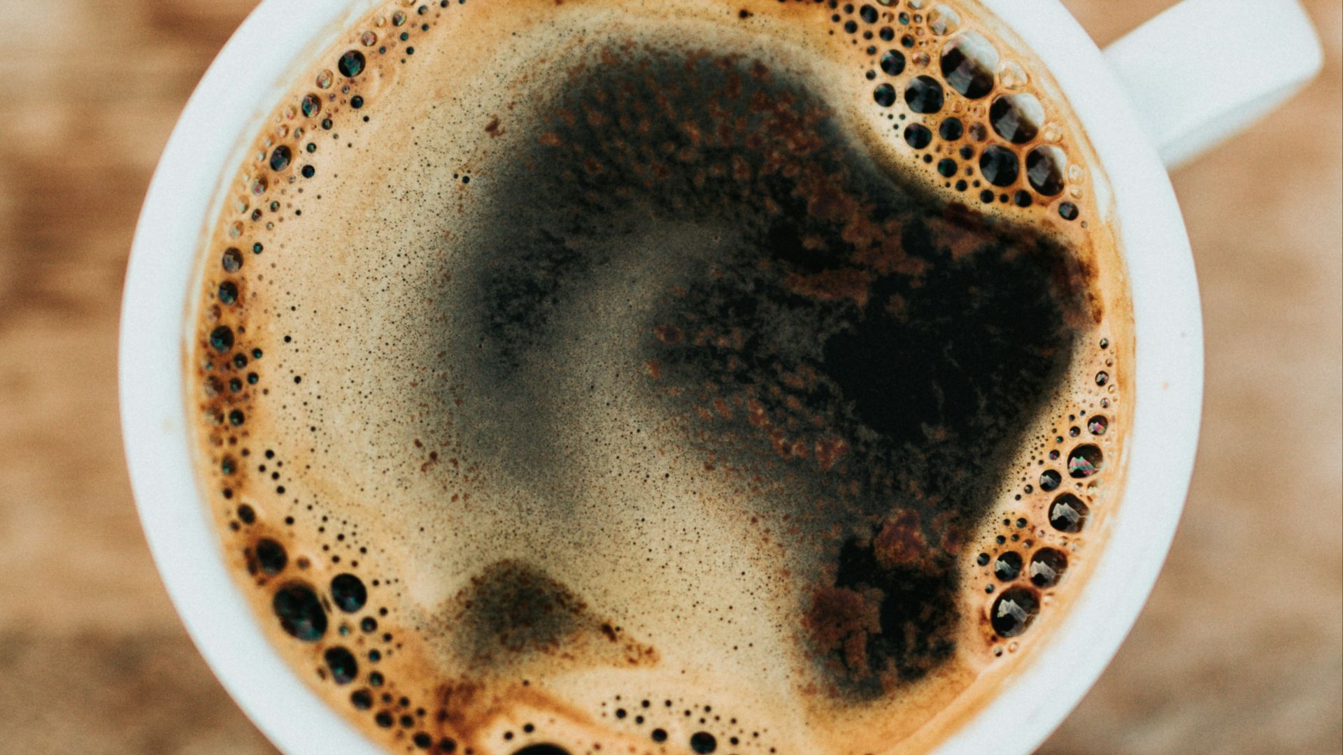 white ceramic mug filled with coffee