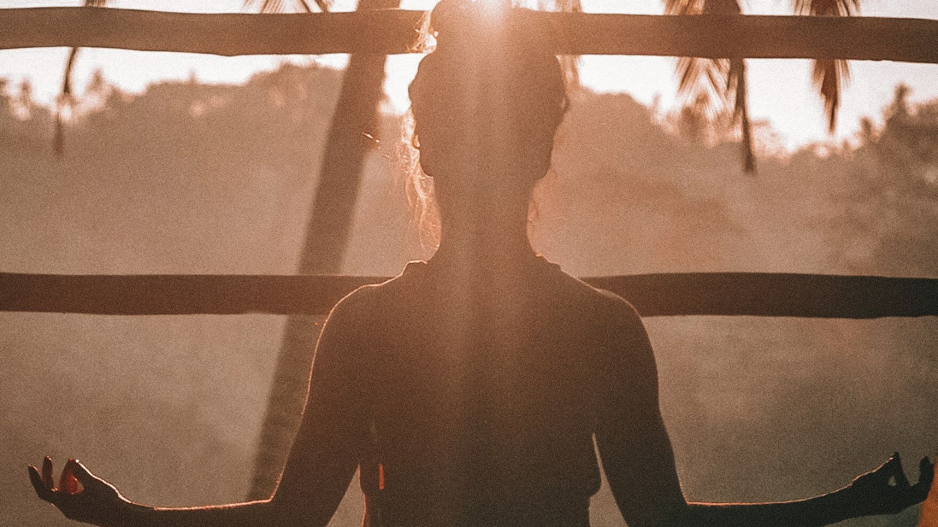 woman doing yoga meditation on brown parquet flooring