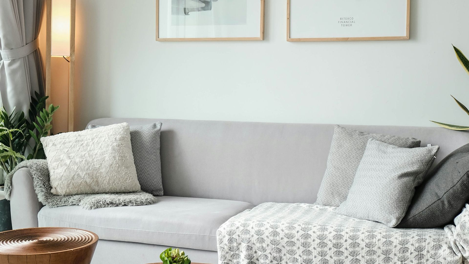 a living room filled with furniture and a large window