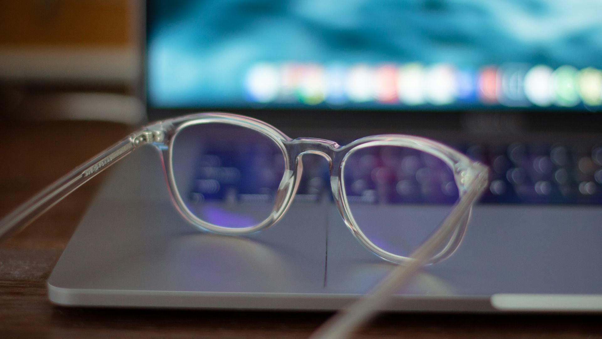 silver framed eyeglasses on white table