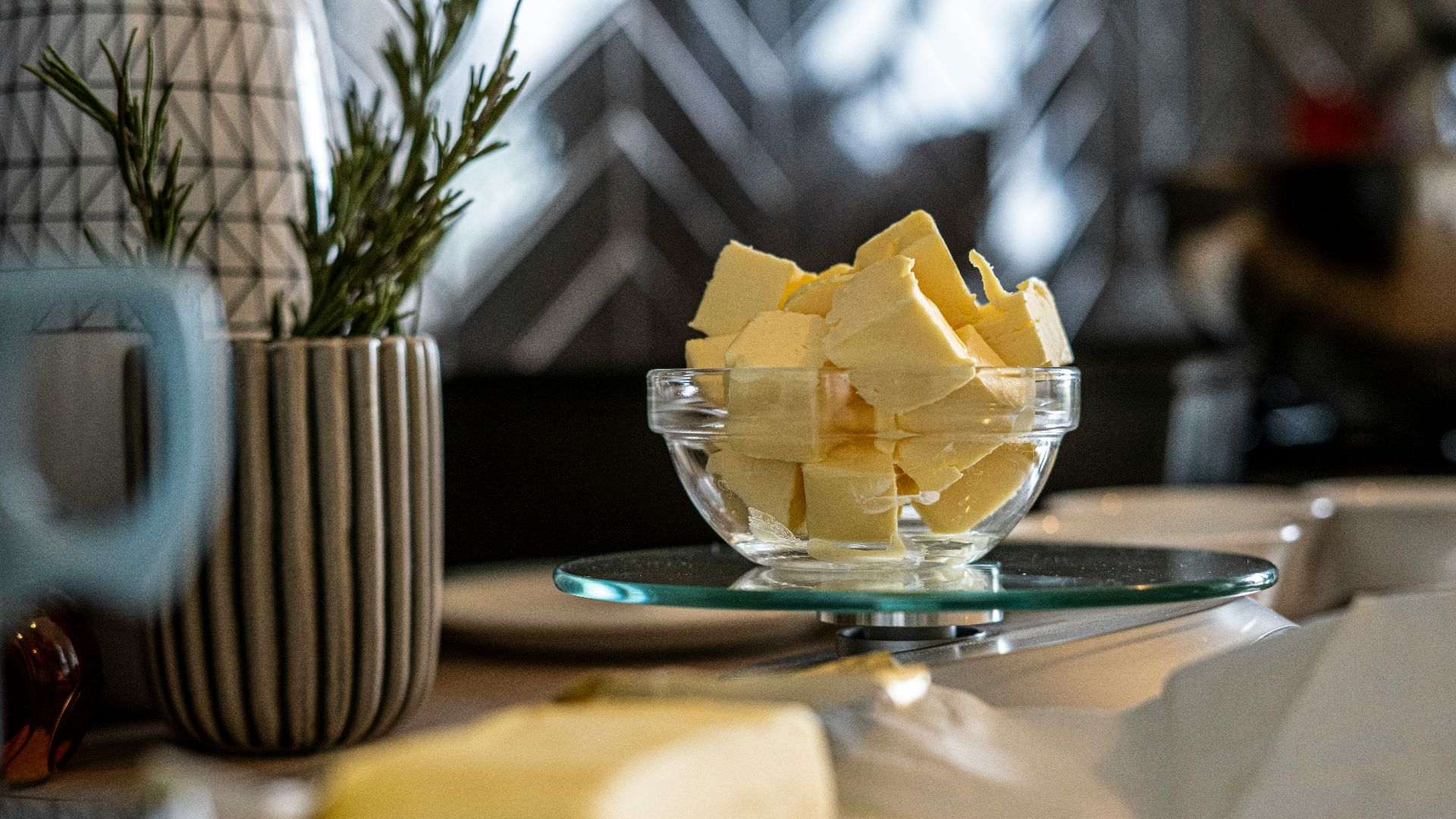 yellow cheese on green and white ceramic plate