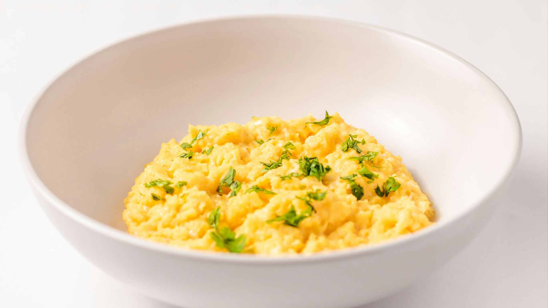 a close up of a bowl of food on a table