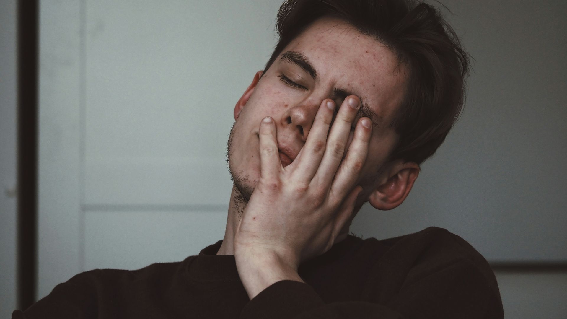 man wearing black crew-neck top