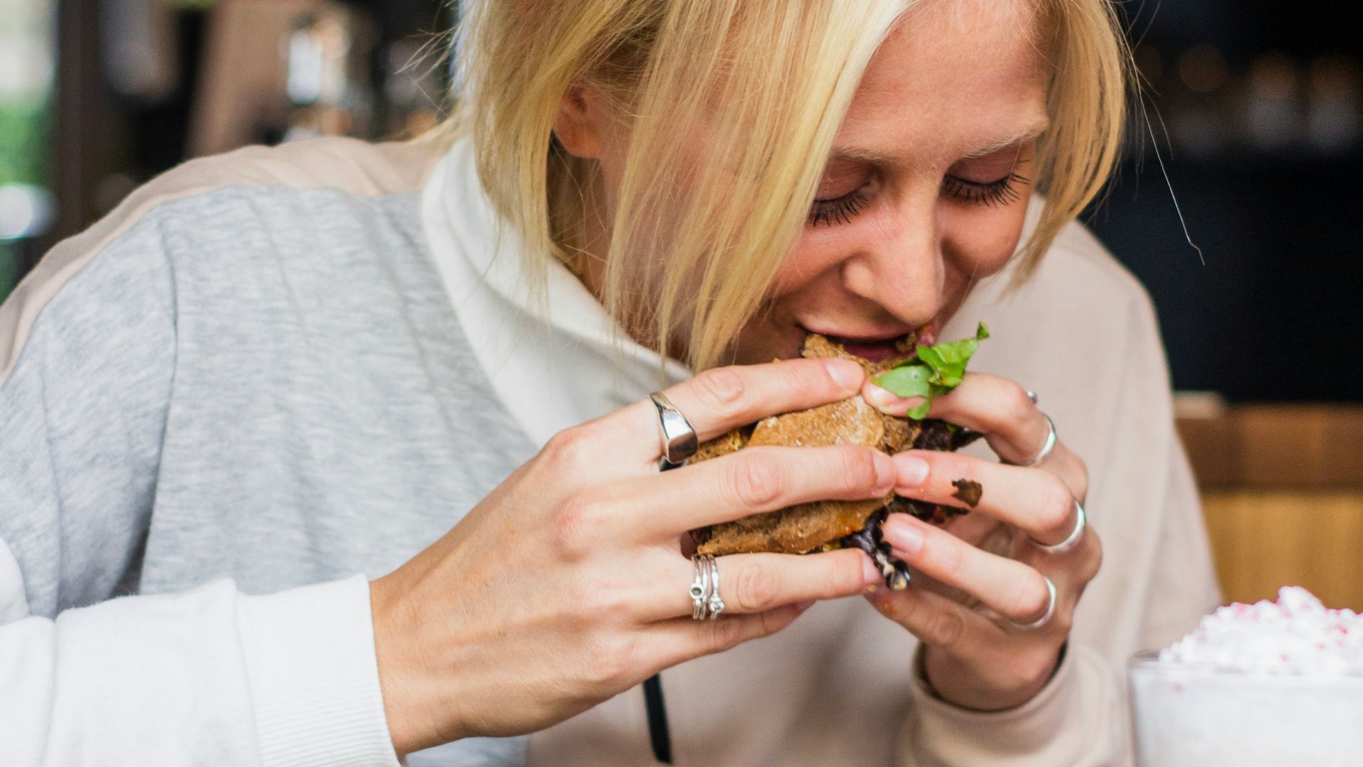 woman eating burger