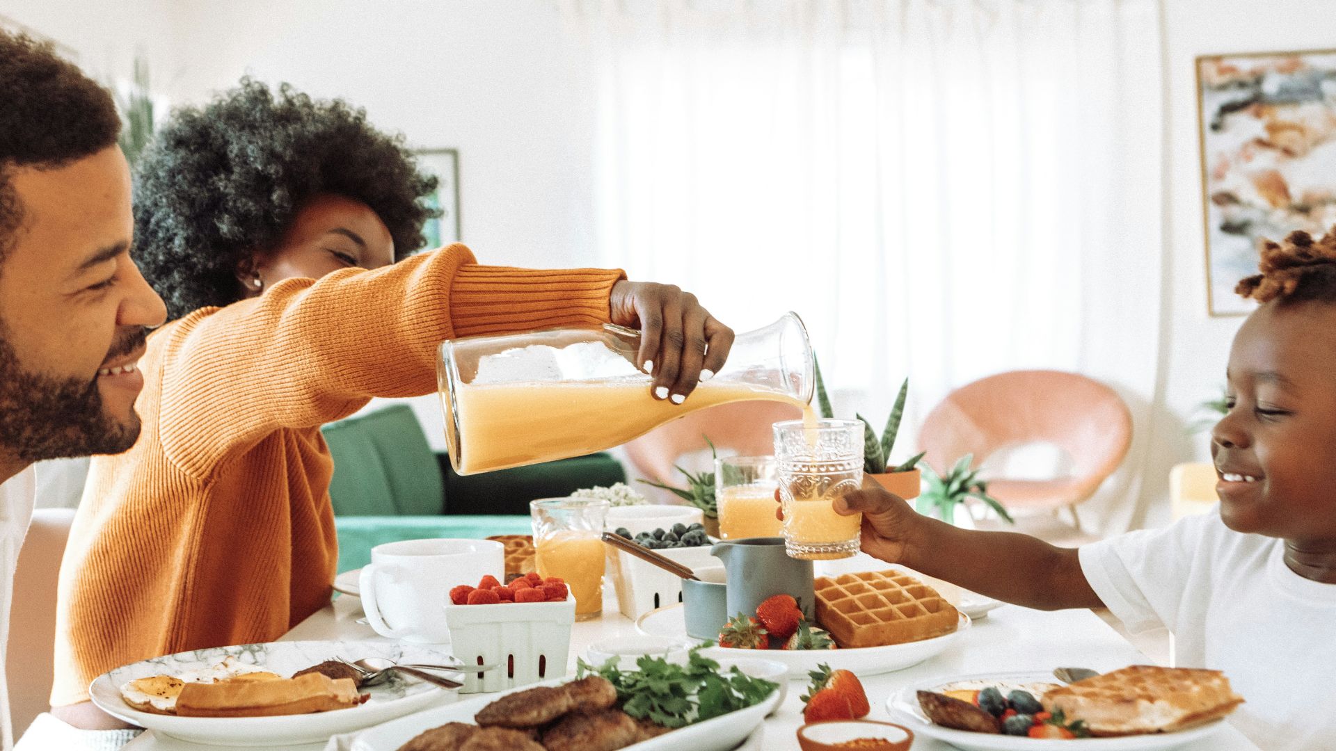 man in yellow sweater sitting beside woman in yellow sweater