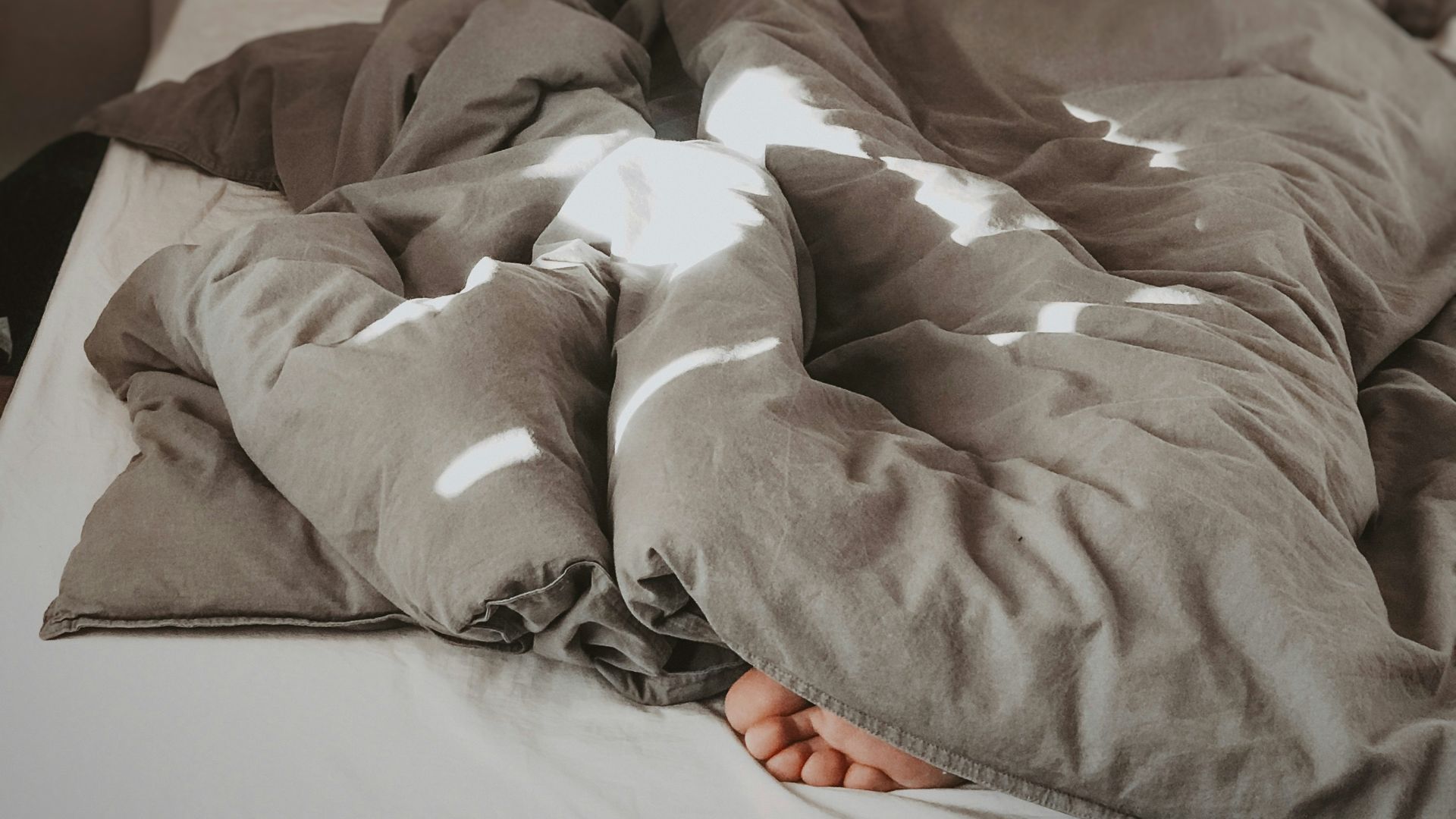 brown and white bed linen