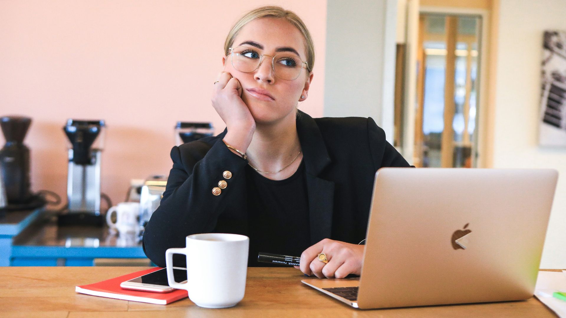 woman in black long sleeve shirt using macbook