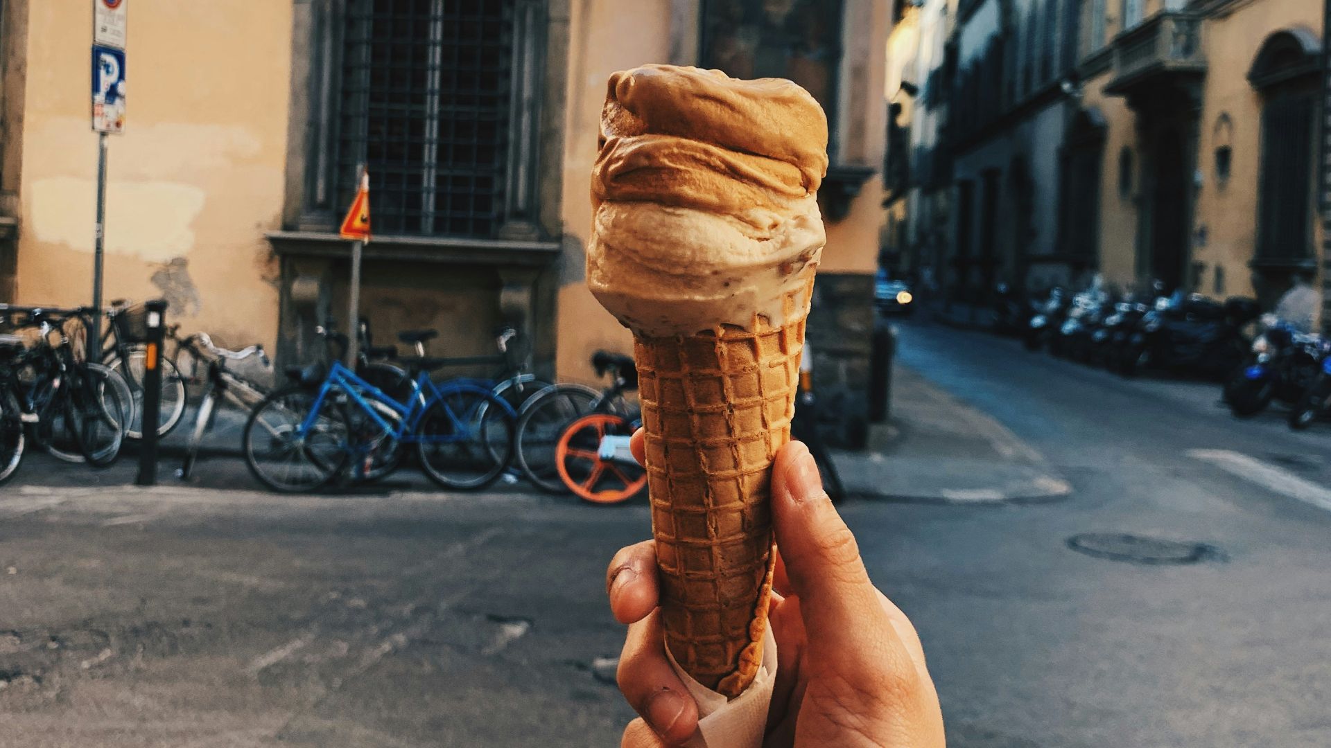 person holding ice cream cone