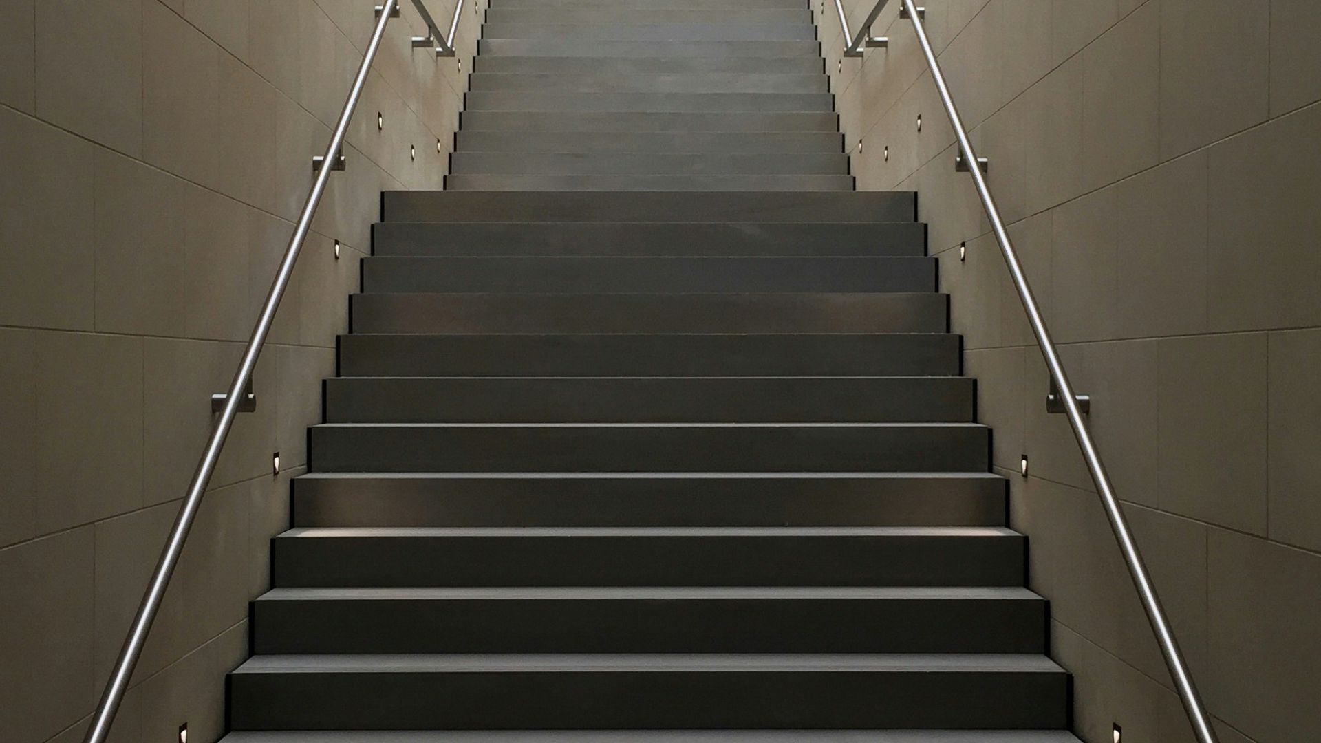 gray concrete stair with gray steel handle