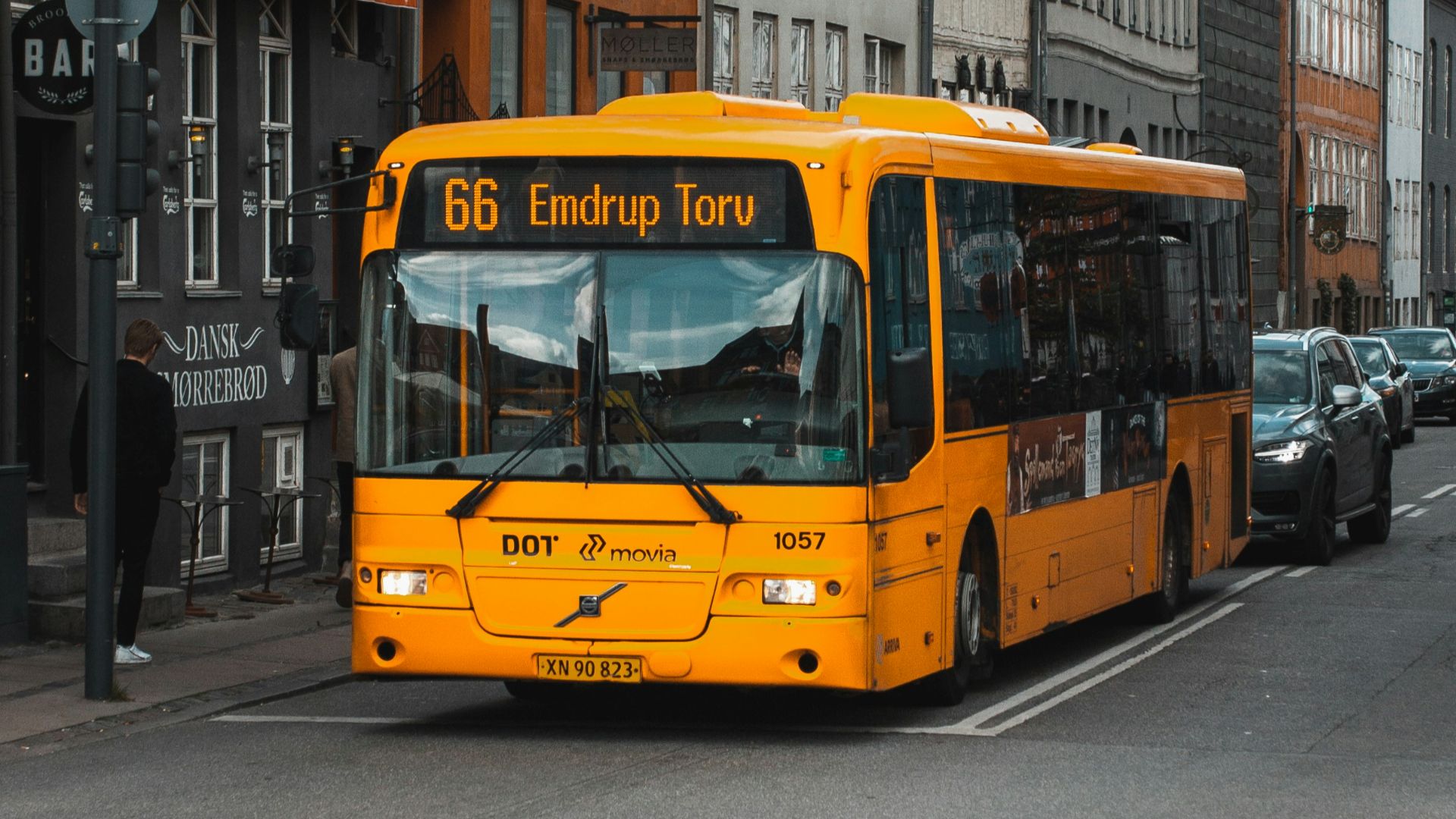 yellow and black bus on road at daytime
