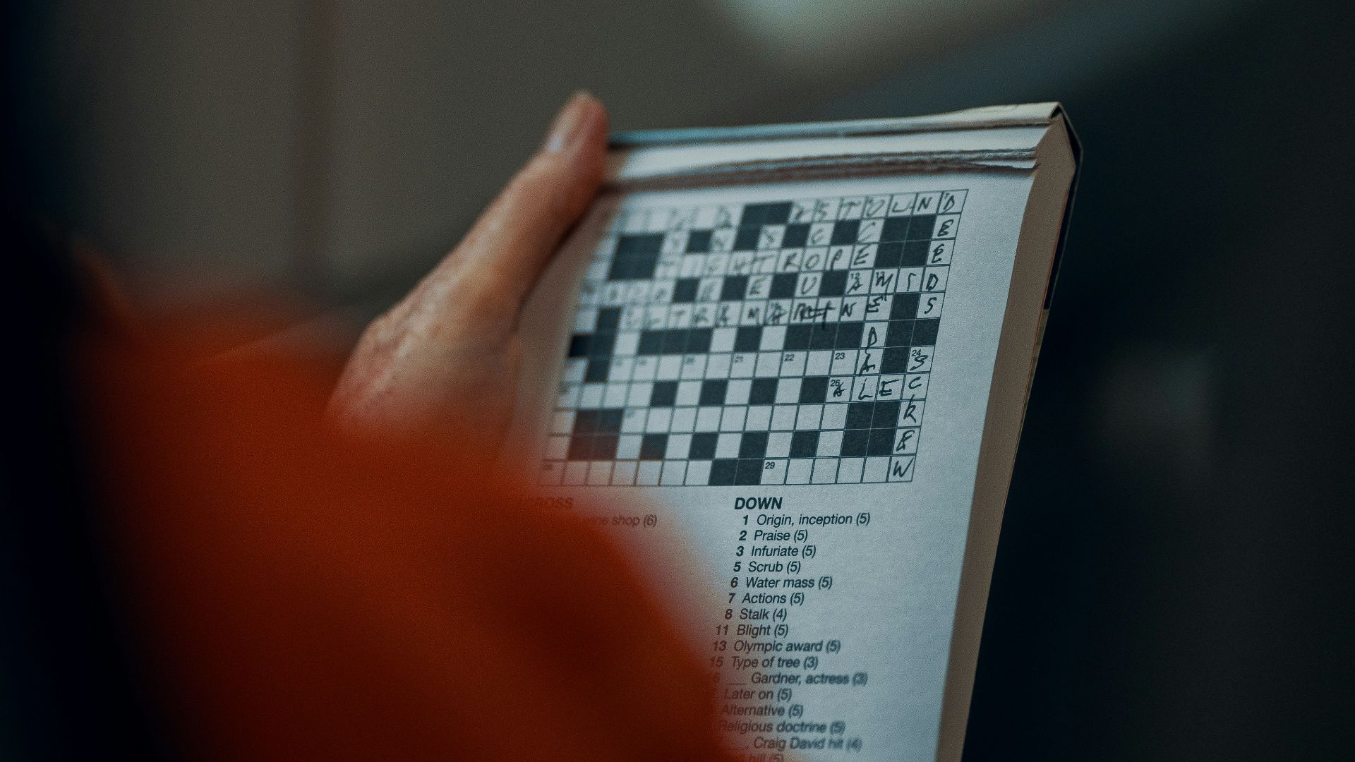 person holding white and black paper