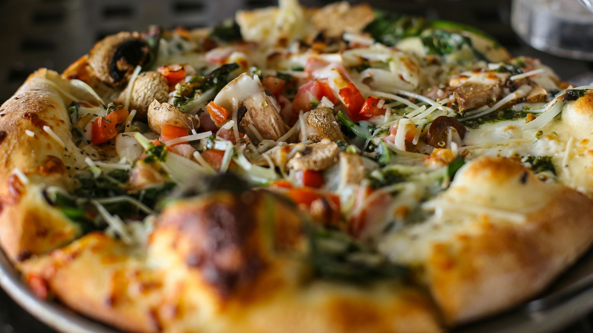 a pizza sitting on top of a pan on a table