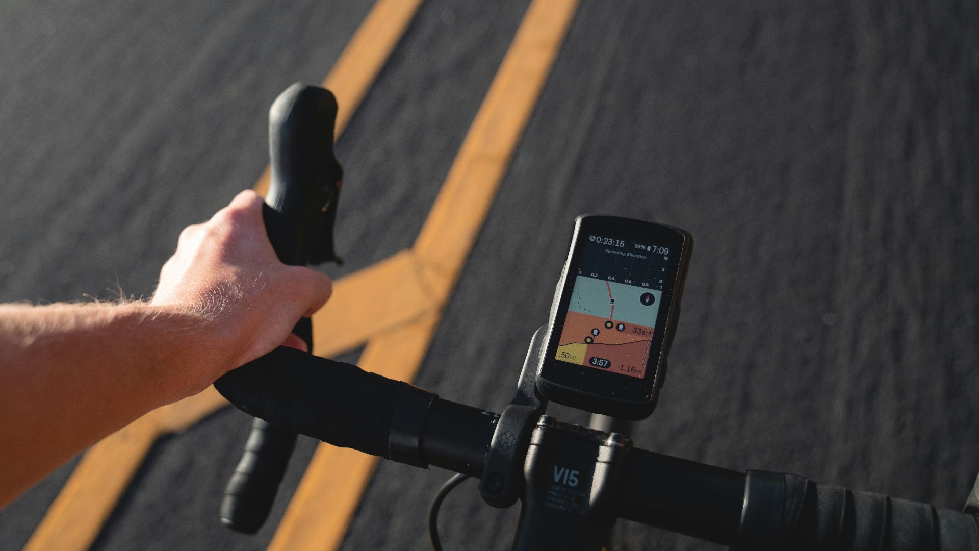 a person riding a bike with a gps app on the handlebars