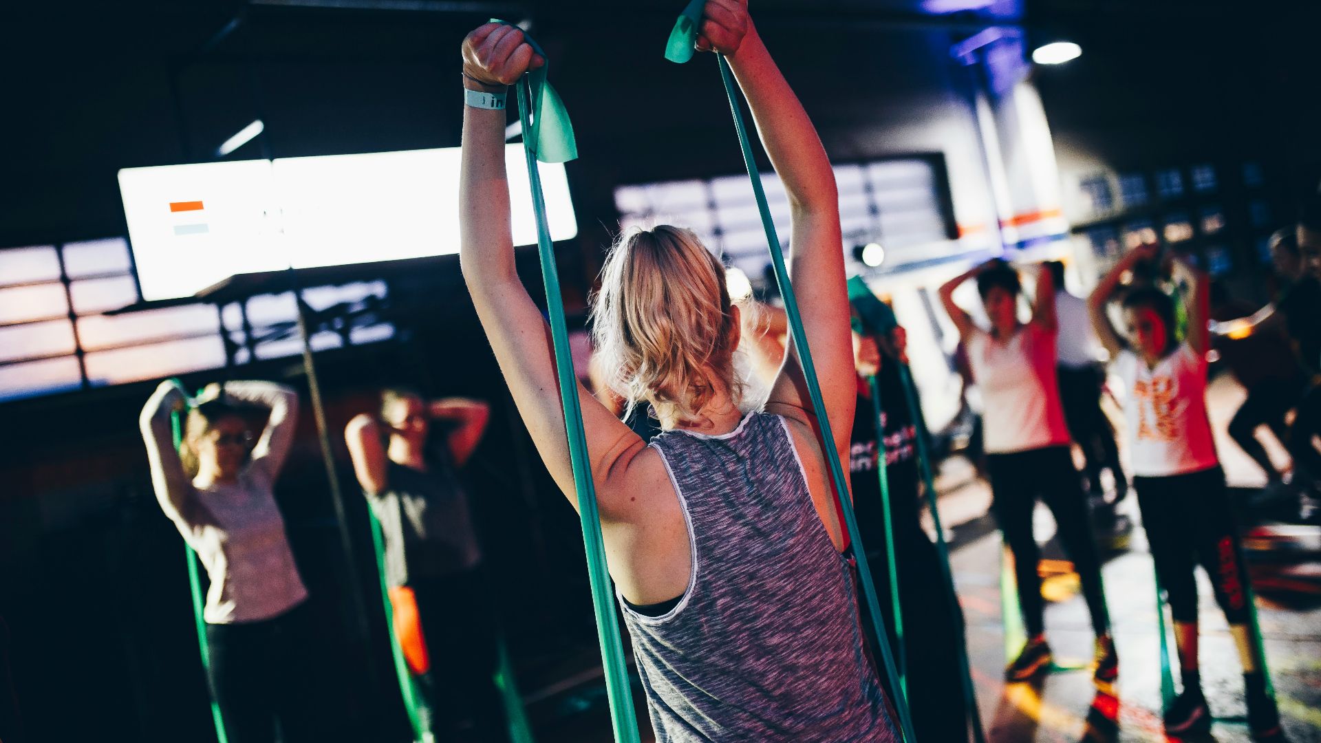 group of people in gym while exercising
