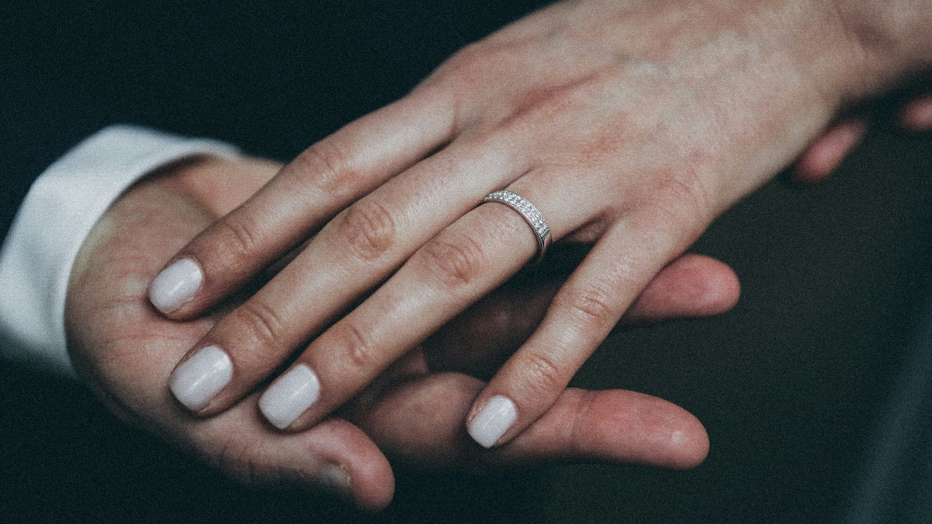 woman wearing silver-colored ring