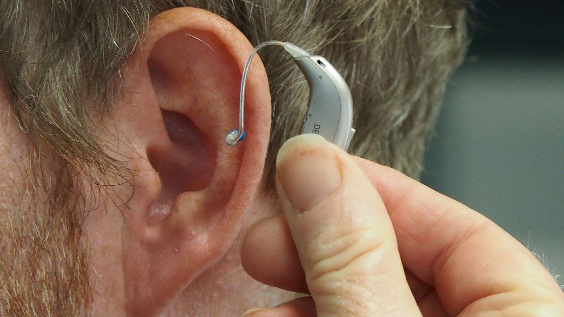 a man wearing a pair of ear piercings