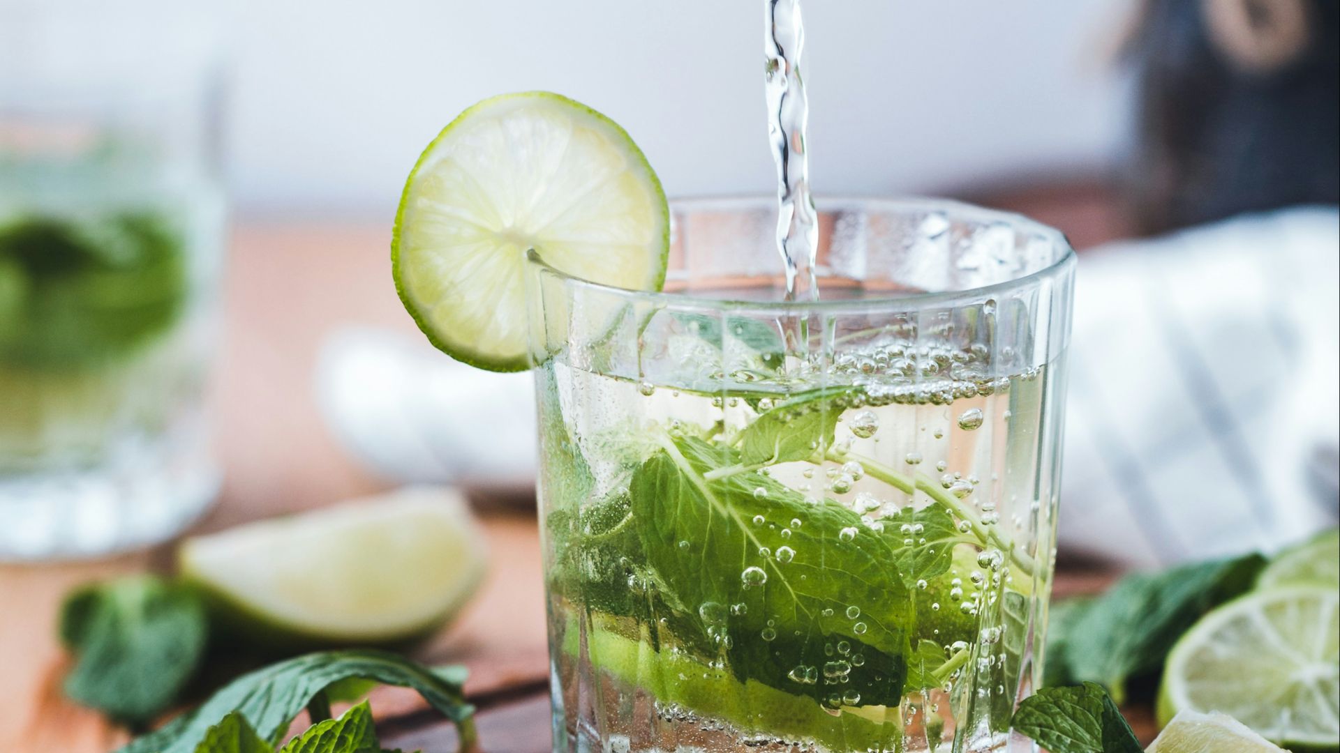 clear glass cup on brown wooden surface