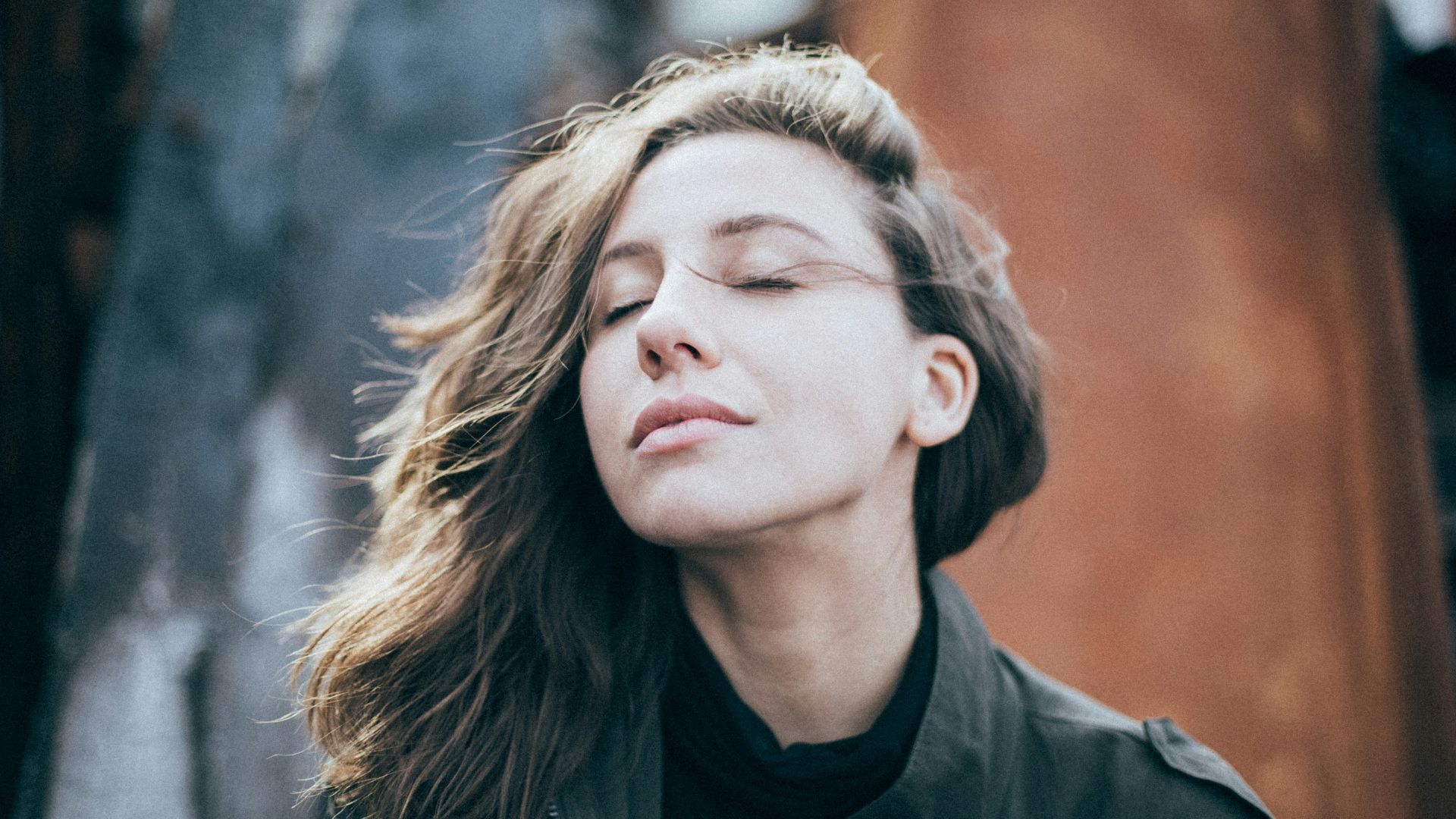 closeup photo of woman wearing black top