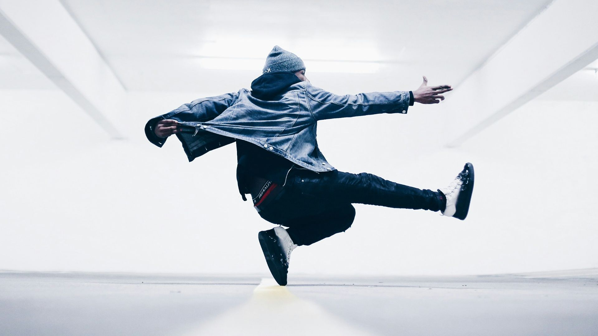 man jumping in the middle taken at daytime