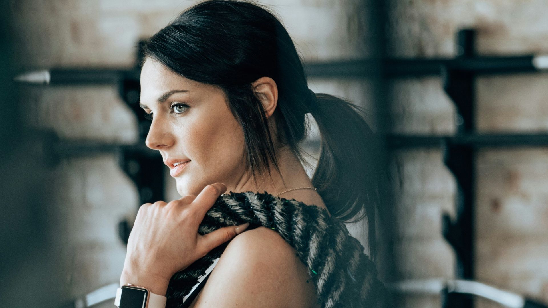 woman holding black rope