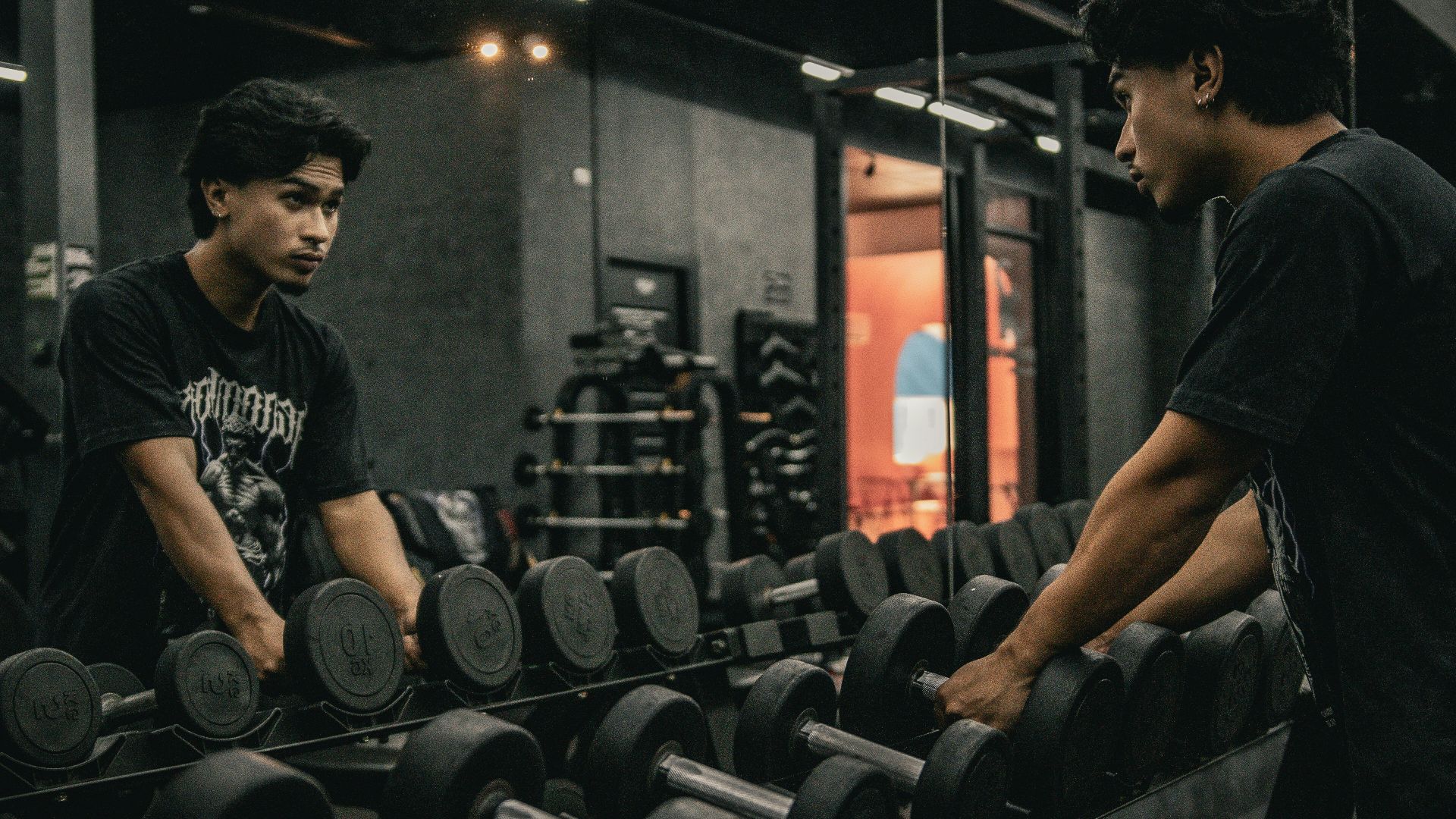 A couple of men working out in a gym
