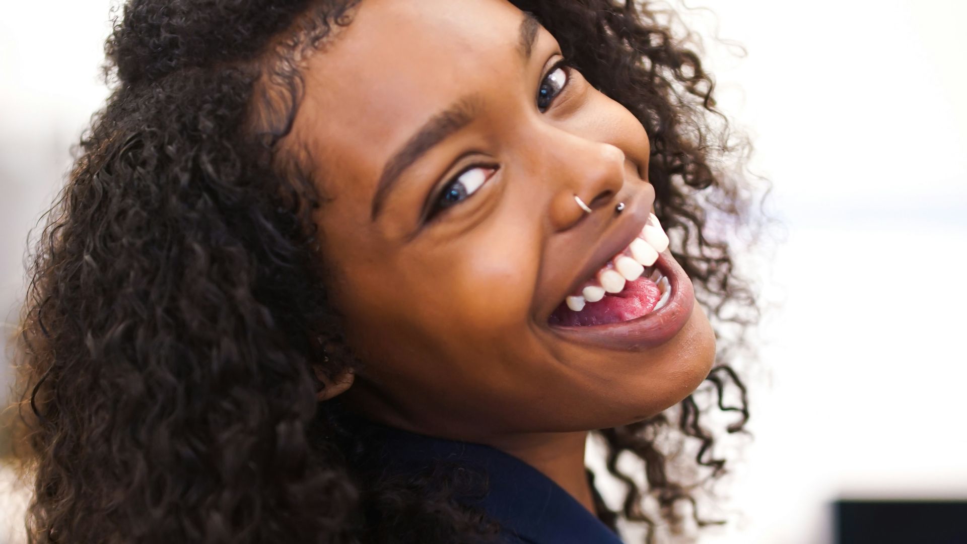 woman looking back while smiling