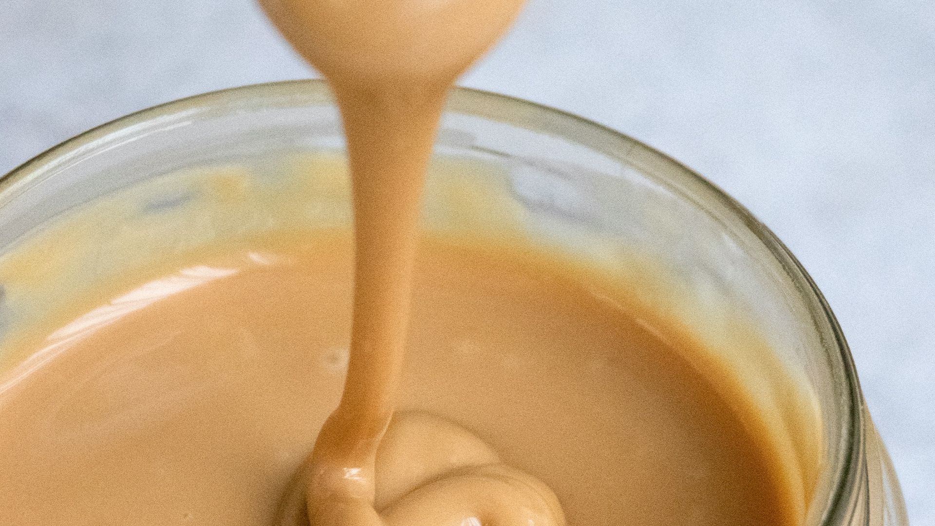 clear glass jar with brown liquid