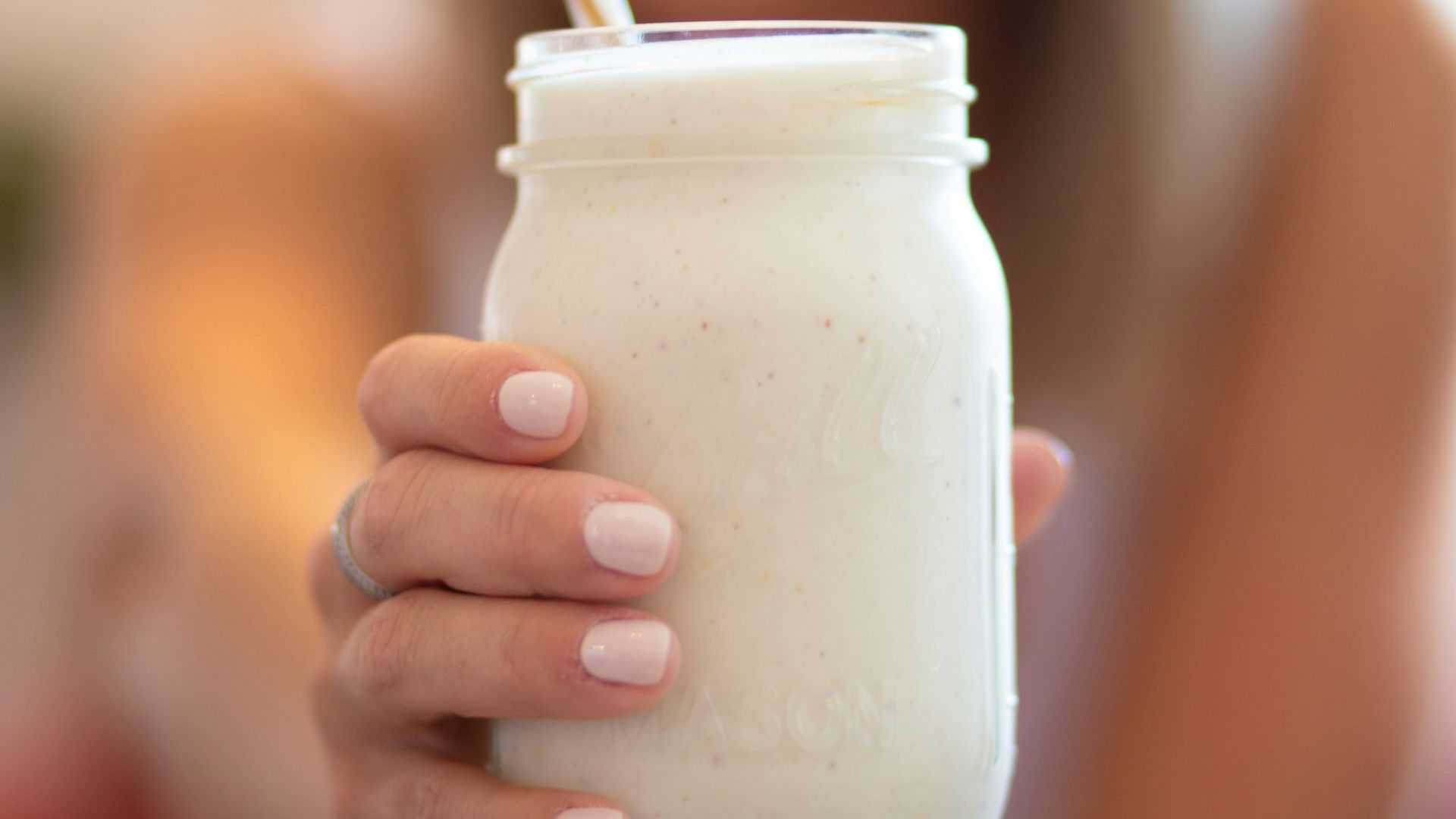 woman holding glass jar