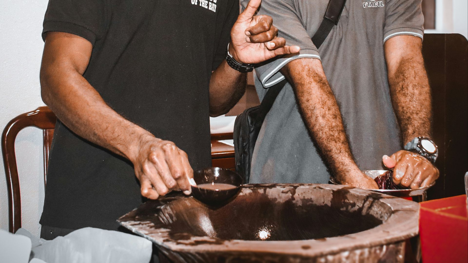 a couple of men standing next to each other