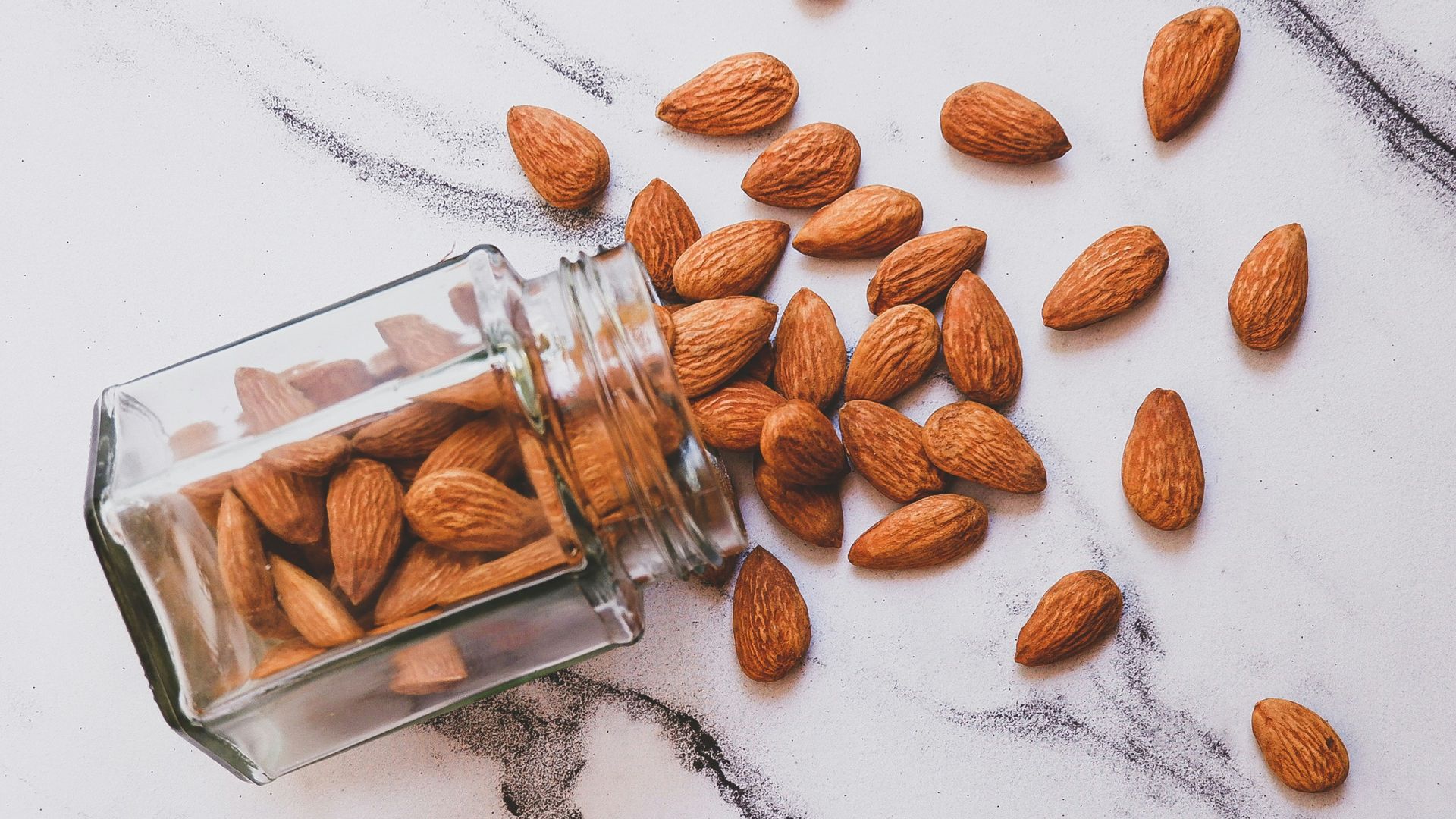 brown almond on white table