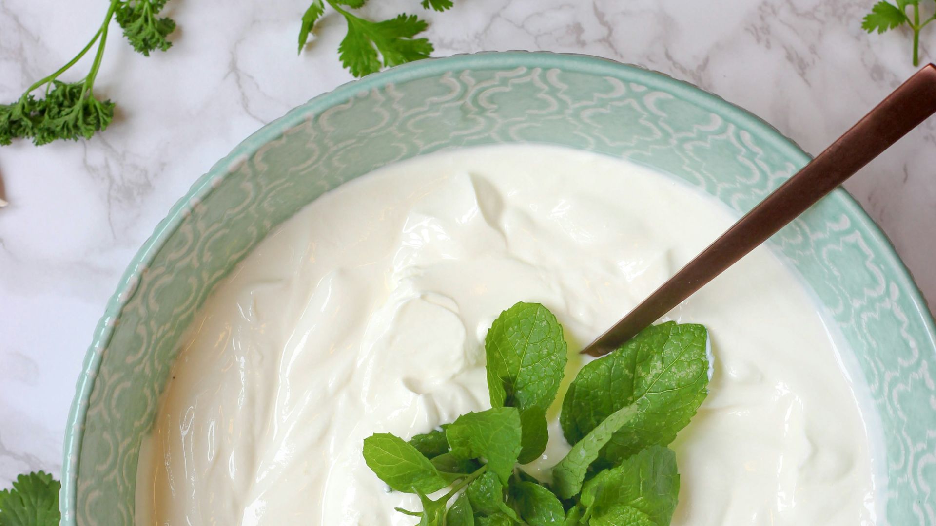a bowl of yogurt with a spoon in it