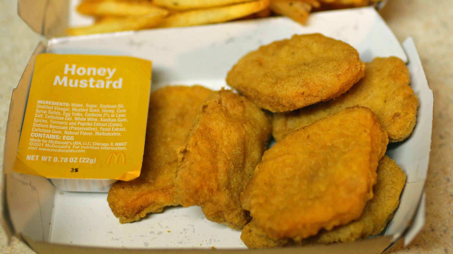 Mcdonald's chicken nuggets with fries.