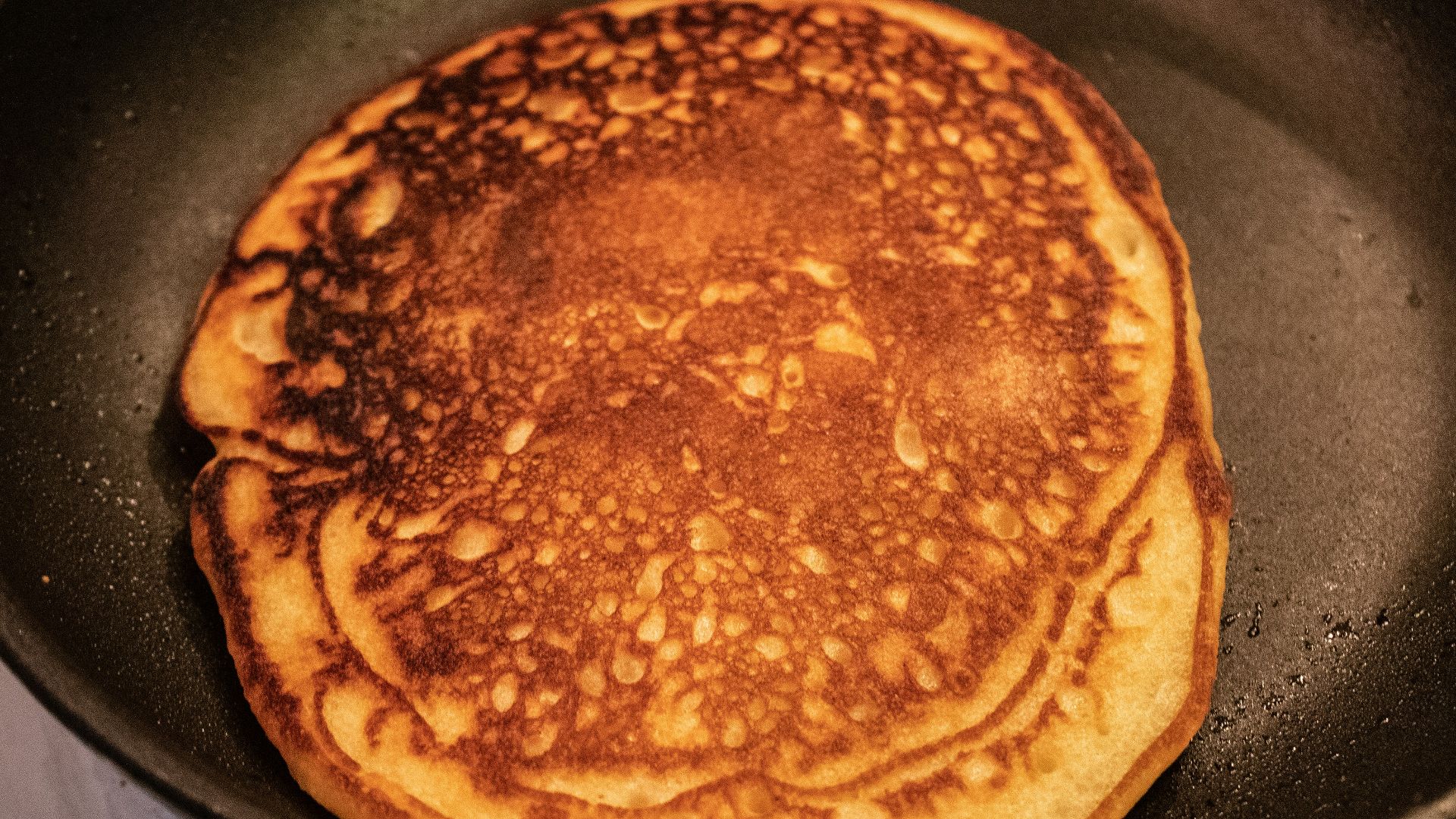 brown and black pastry on black pan