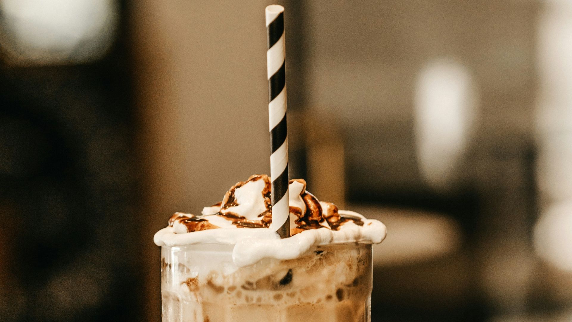 full-filled cream glass on table
