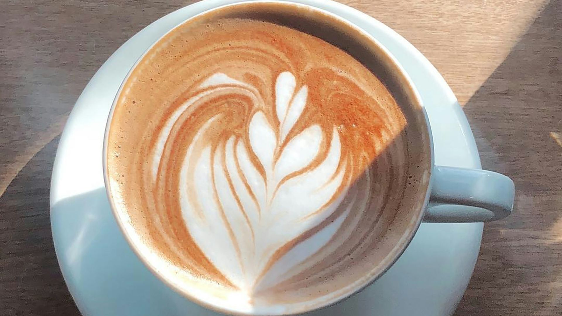 white ceramic cup with brown and white liquid
