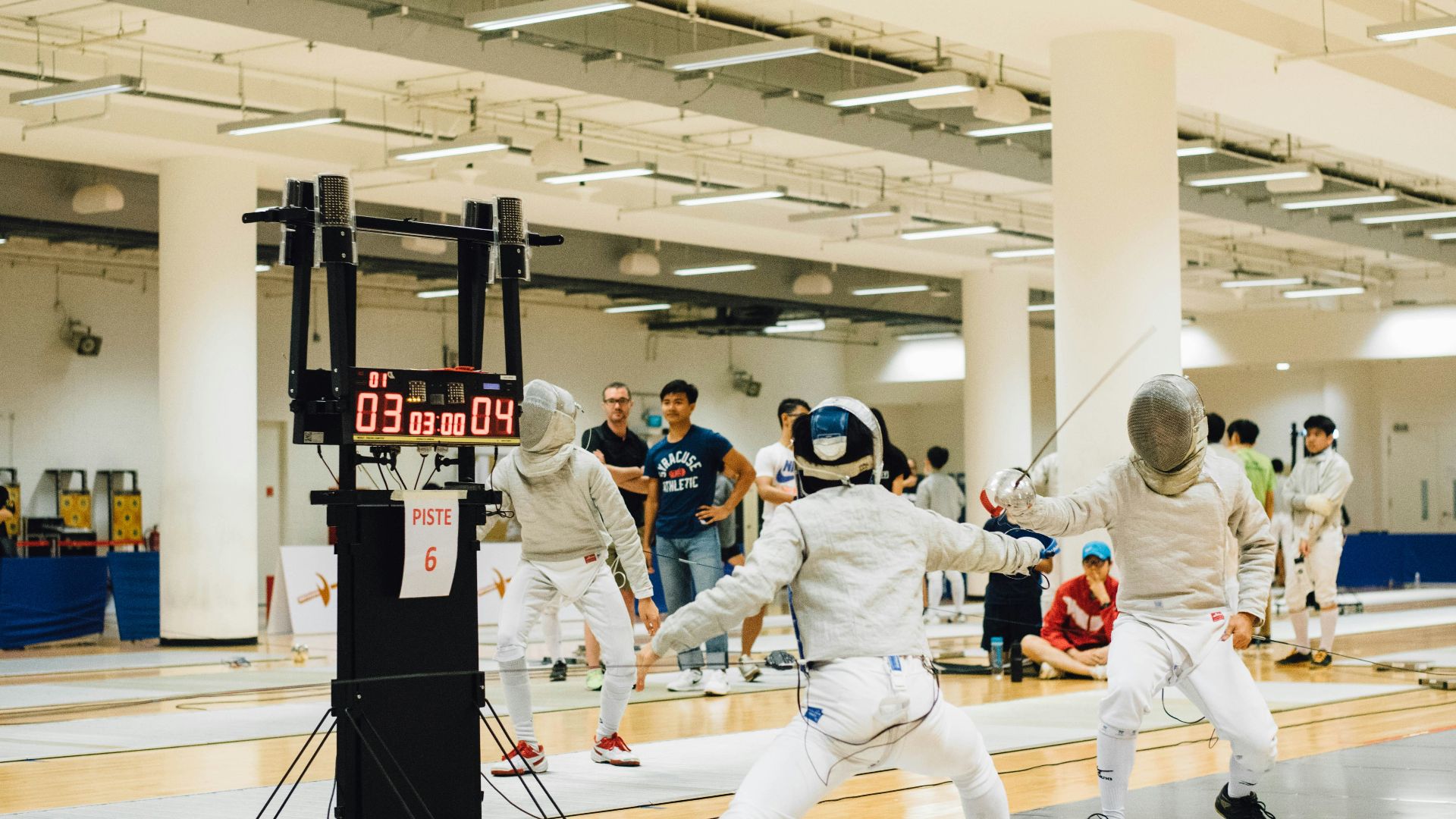 two person wearing white suit doing fencing