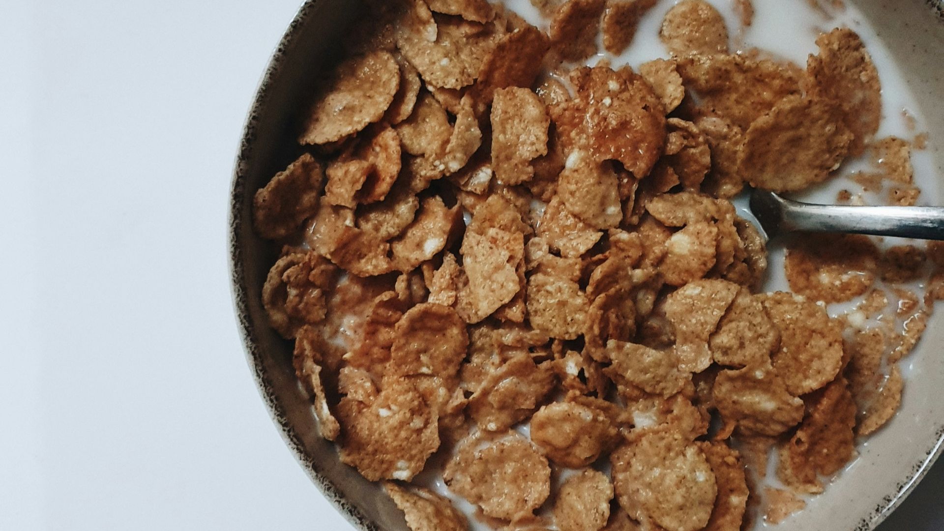 a bowl of cereal with a spoon in it